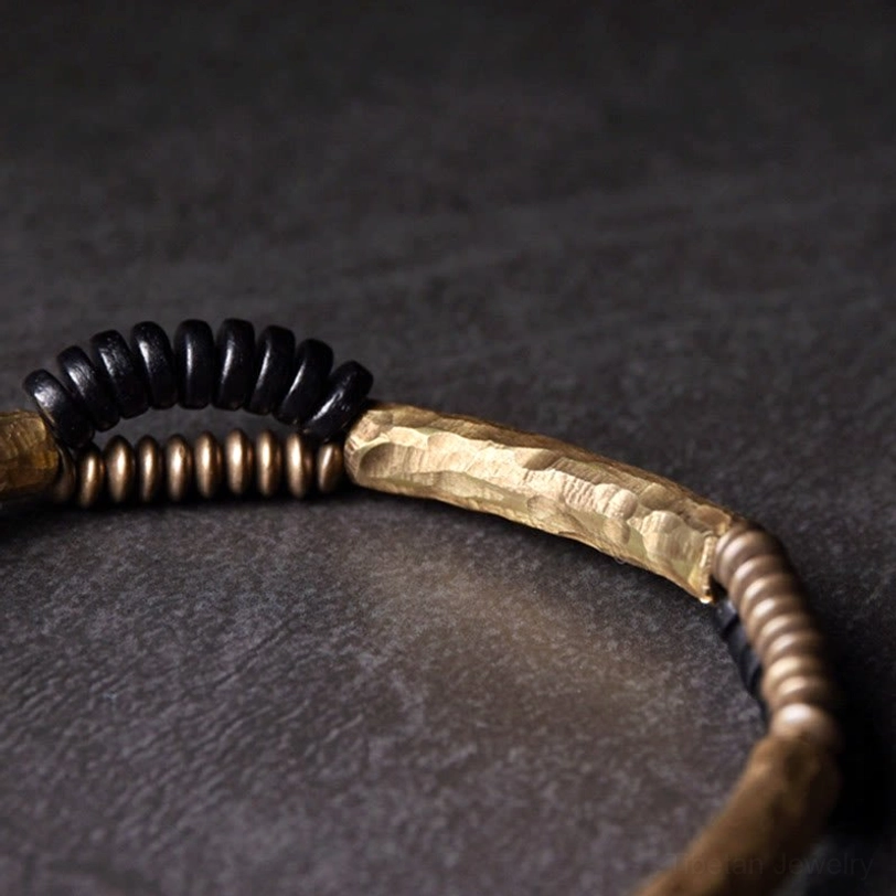 Single handmade ebony wood copper bracelet side close-up showing hammered metal bar detail
