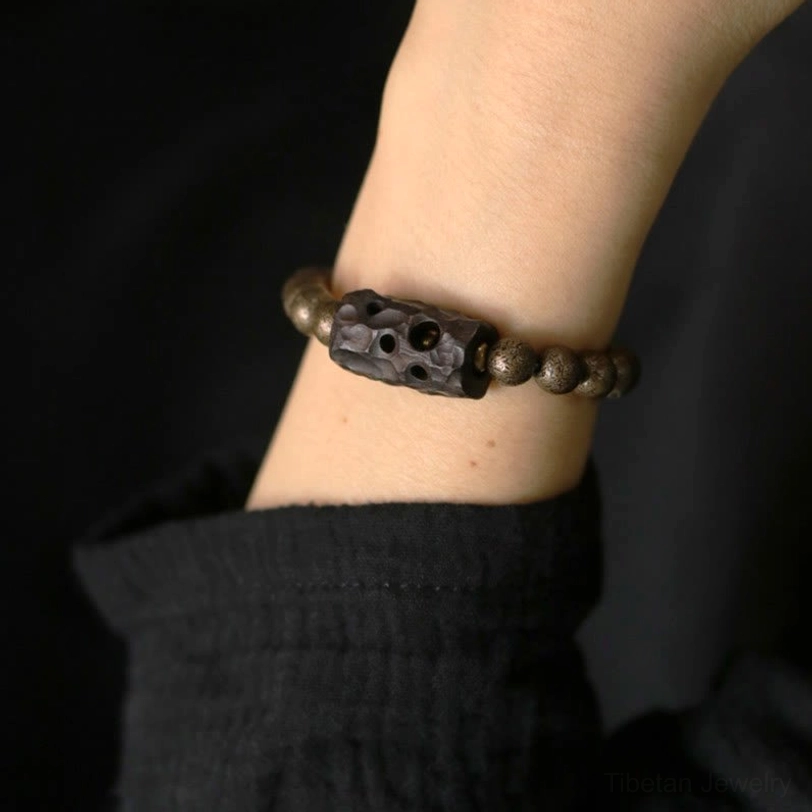 Spiritual wood copper bracelet on wrist showing fit and comfortable wear with daily clothing