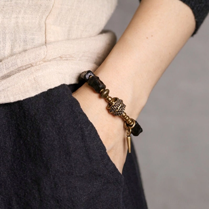 Ebony wood copper couple bracelet worn on left wrist with casual linen outfit styling