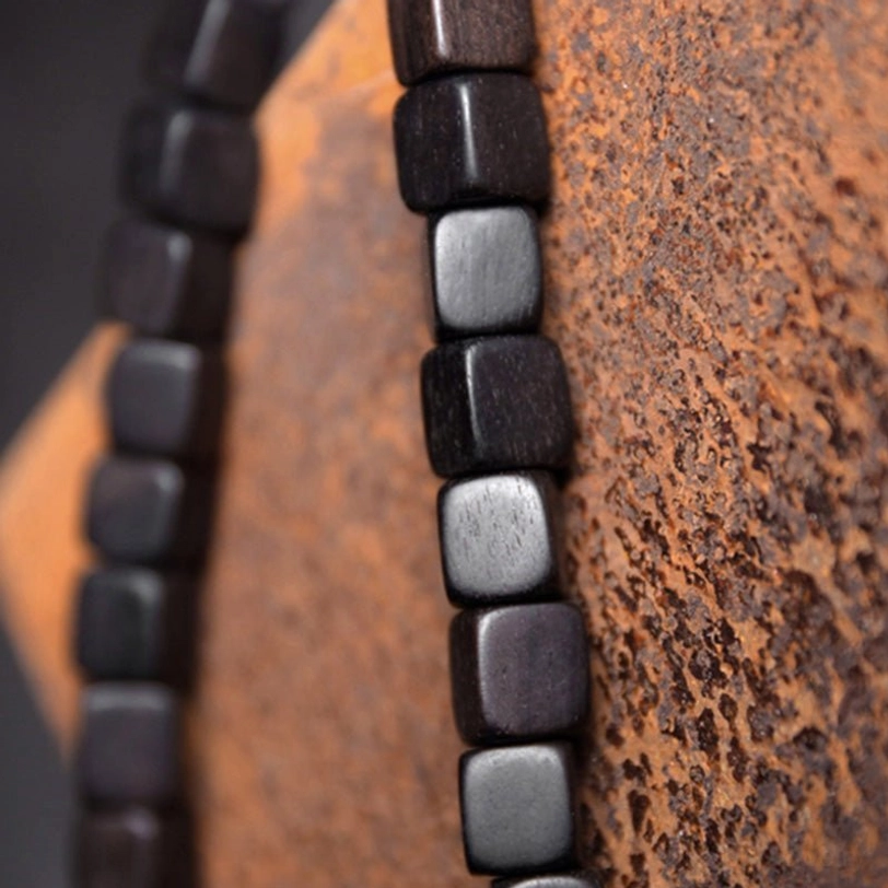 Ebony wood nine-eye dzi bead couple bracelet featuring premium elastic string construction and hand-painted tibetan spiritual symbolism