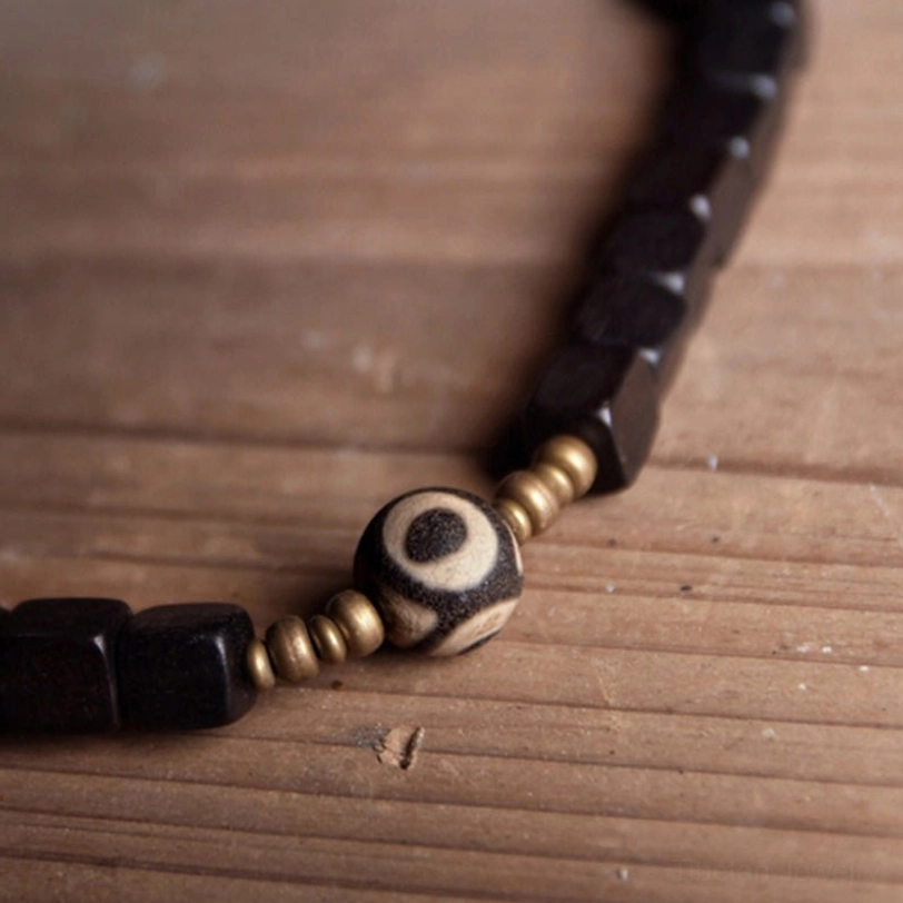 Ebony wood nine-eye dzi bead couple bracelet size comparison showing bracelet dimensions and fit for different wrist sizes