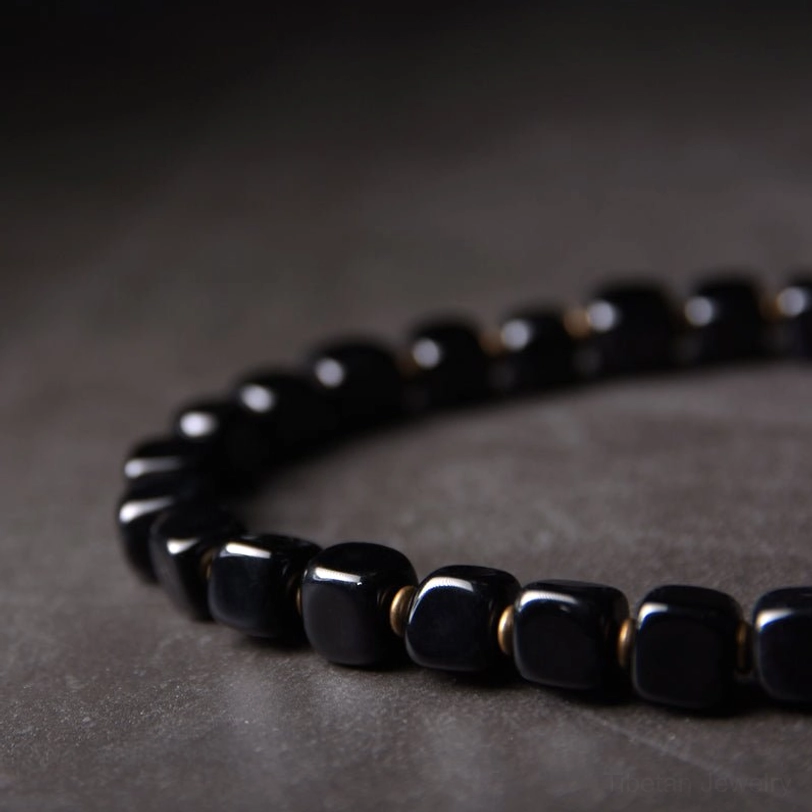 Ebony wood dzi bead couple bracelet worn styling suggestion showing how to layer or wear as protective spiritual jewelry