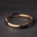 Handmade ebony wood and copper prosperity bracelet flat lay showing hammered metal accents and mixed bead textures