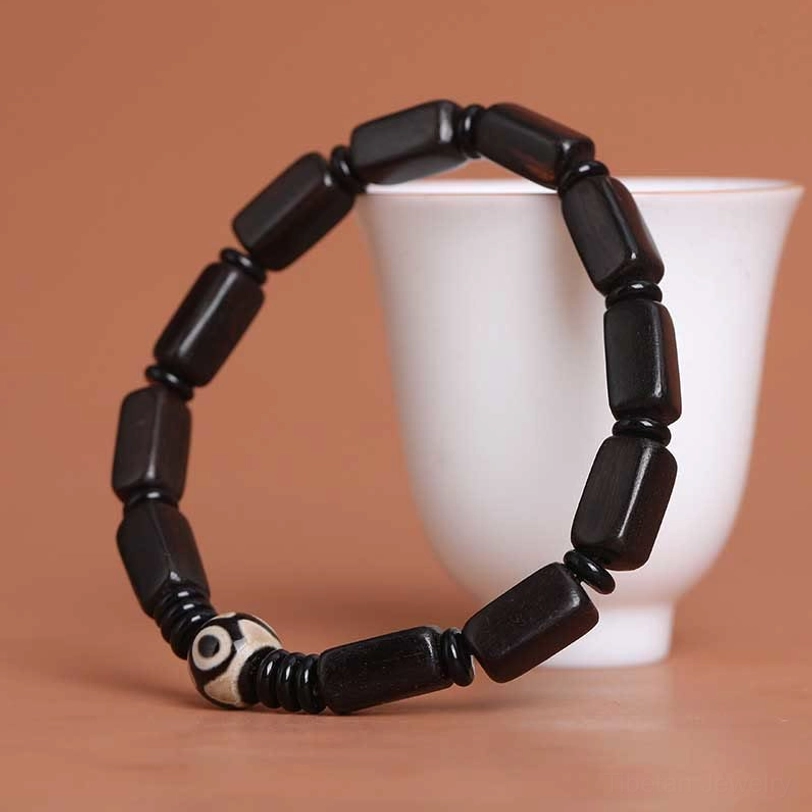Ebony wood rectangular Dzi bead balance bracelet complete product view showing all bead elements and construction