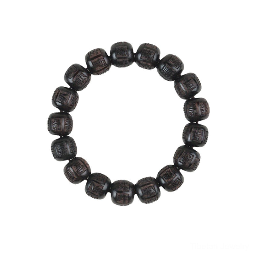 Handcrafted ebony wood prayer bracelet Om Mani Padme Hum sacred mantra beads close-up