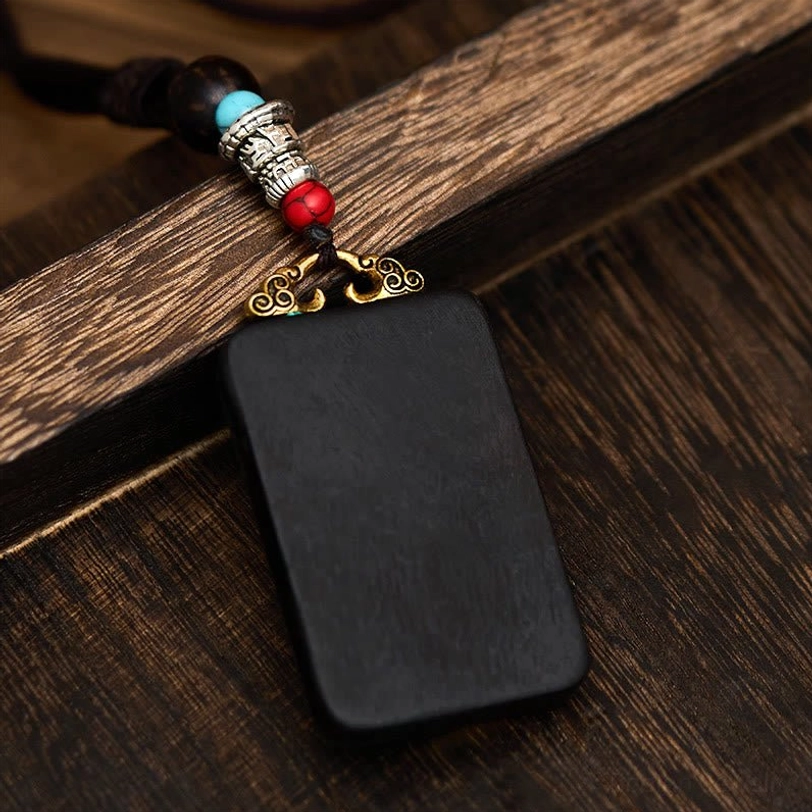 Plain ebony wood rectangular pendant on beaded necklace rope strap