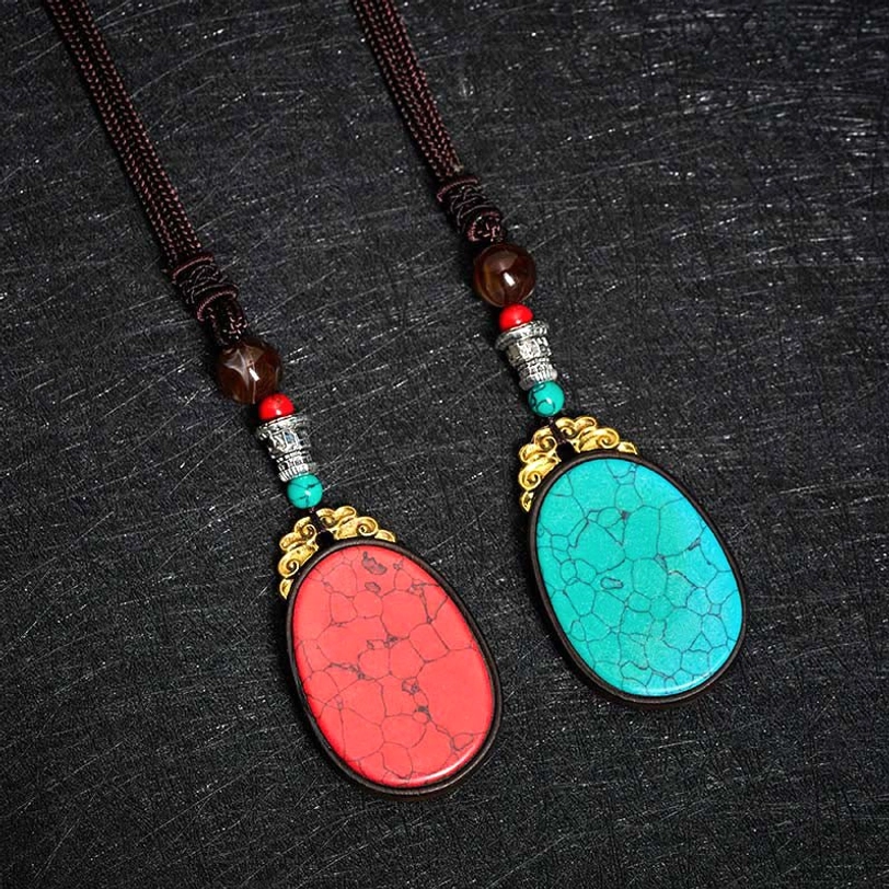 Multiple ebony wood Tibetan necklace variations showing natural color diversity and uniqueness