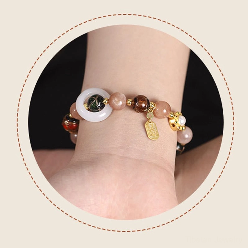 Elastic prayer cord Tibetan bracelet with mixed gemstones and gold prayer wheel charm for daily wear