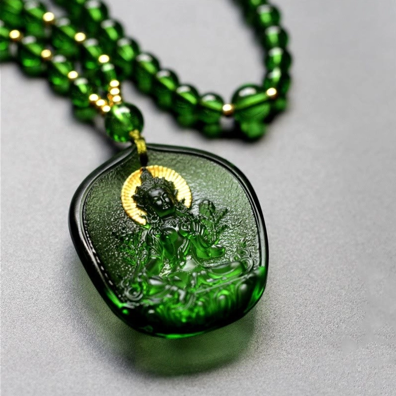 Emerald green Liuli glass Tara pendant with gold halo and Buddha relief, handcrafted crystal jewelry