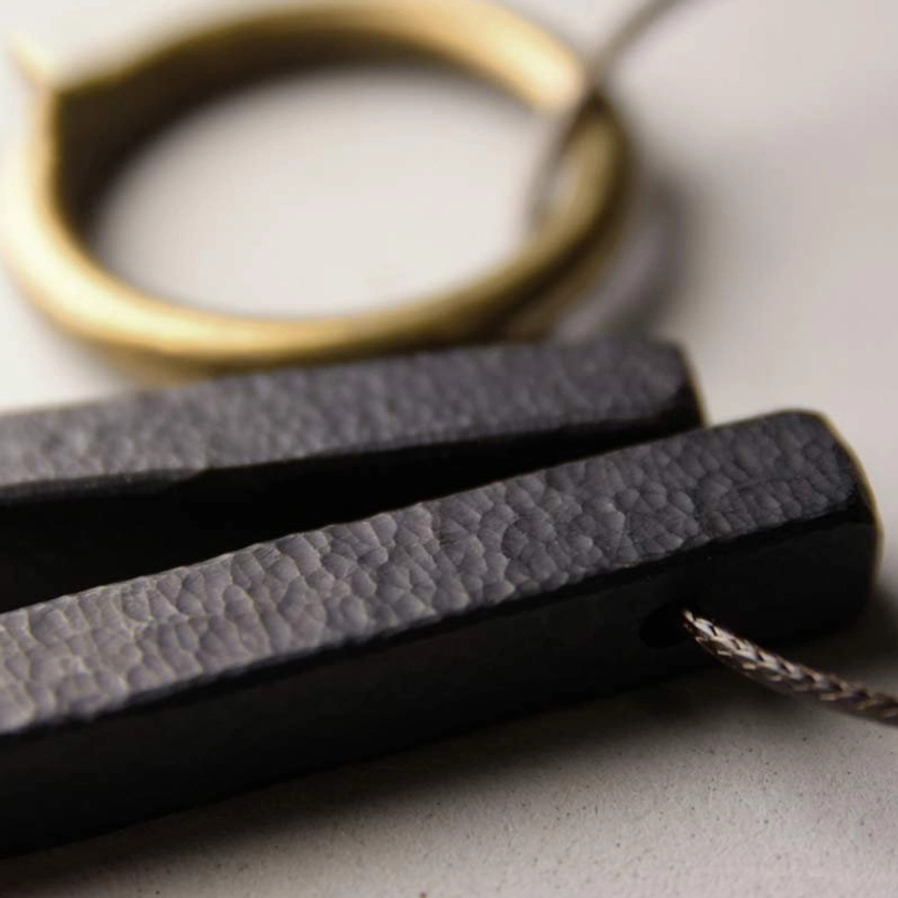 Handmade ebony wood Enso pendant necklace artistic detail view natural wood grain