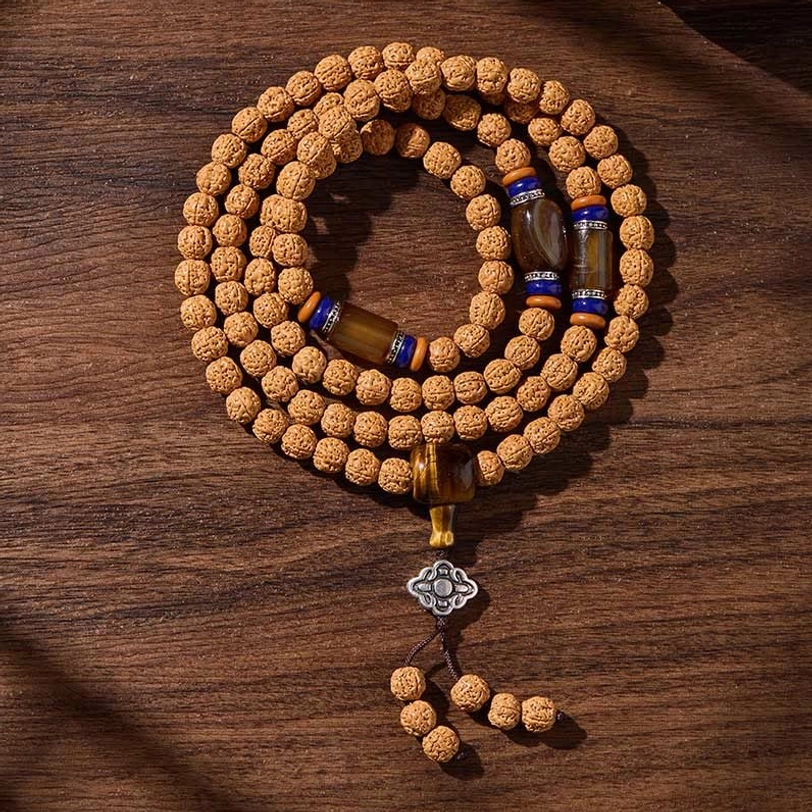 Evergreen through hardship dzi mala bracelet, symbolizing resilience and inner strength in Tibetan Buddhist spiritual practice