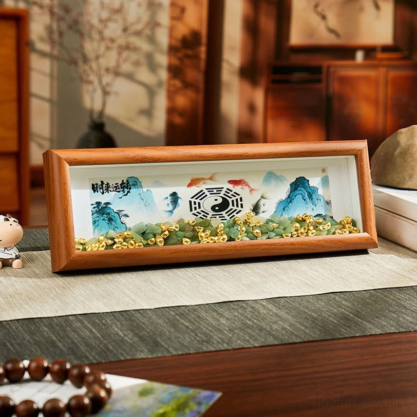 Feng Shui Bagua Koi Fish Yin Yang green crystal photo frame ornament displayed on traditional Chinese home desk with landscape art and decorative gravel