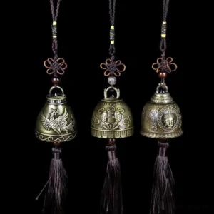 Three-piece feng shui wind chime set with Buddha, Phoenix, and Koi Fish embossed designs on black background