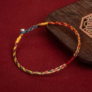 Handmade lucky string bracelet three-quarter view displaying colorful woven threads and silver metal toggle clasp
