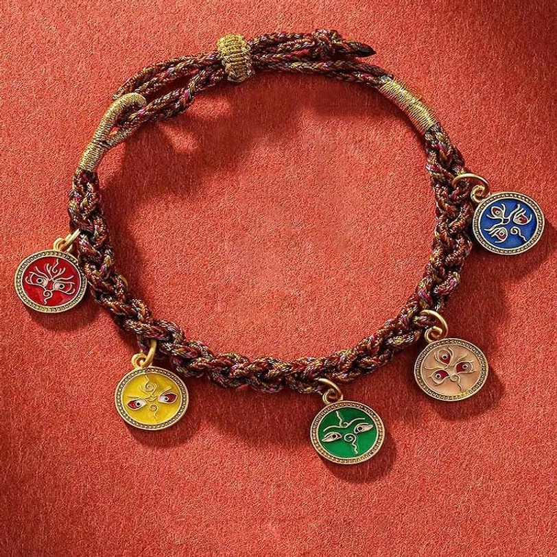 Five God of Wealth Tibetan braided bracelet flat lay showing five colored enamel pendants on woven cord