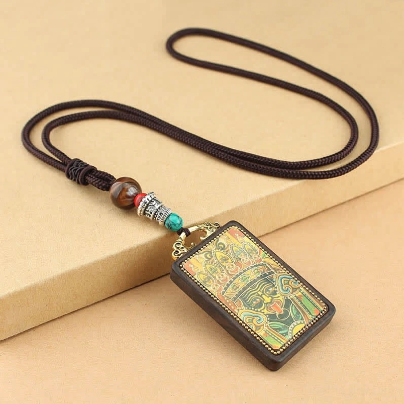 Tibetan Five Gods of Wealth thangka pendant with traditional hand-painted deity artwork and metal accents