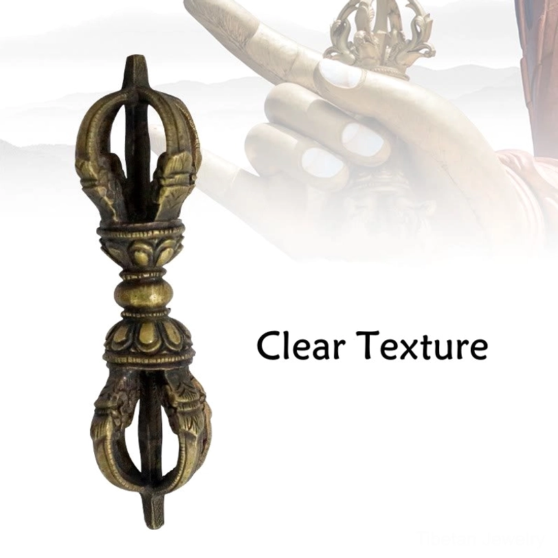 Five-prong Tibetan Vajra Dorje front flat view against light background displaying clear carved decorative texture and religious patterns