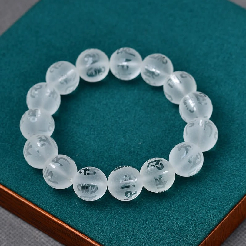 Frosted white crystal Om Mani Padme Hum meditation bracelet with clarity and spiritual enhancement properties