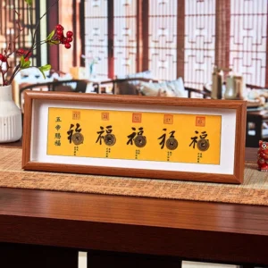 Fu character five-emperor coins feng shui wood frame with golden Fu character and antique copper coins on yellow background, front view