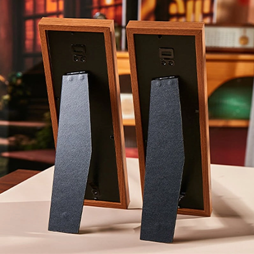 Back view of fu character photo frame showing foldable black desk stand base