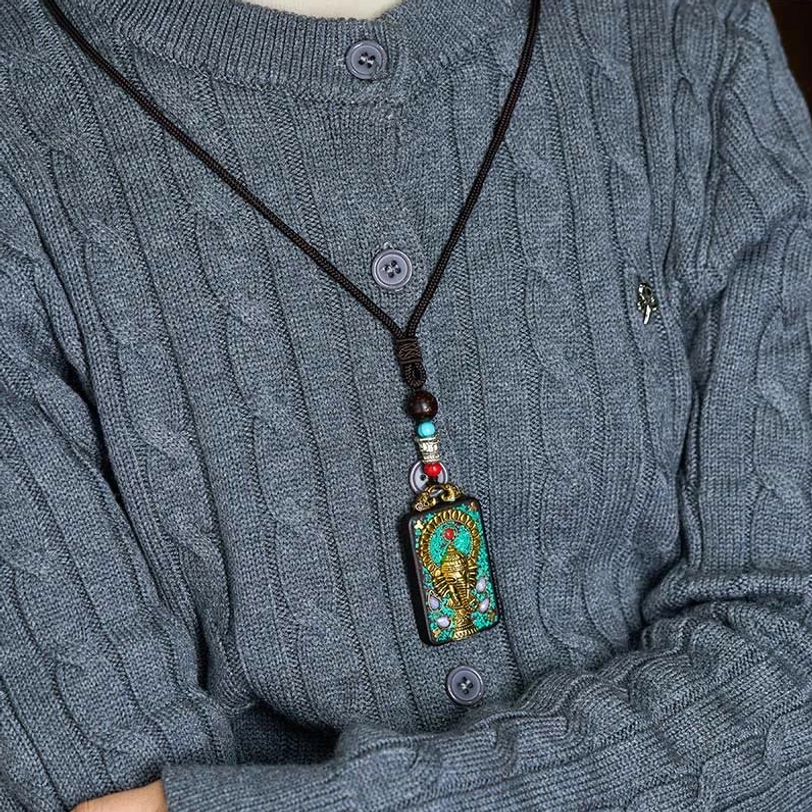 Wearable Ganesha ebony wood pendant necklace styled on grey knit sweater, casual wear