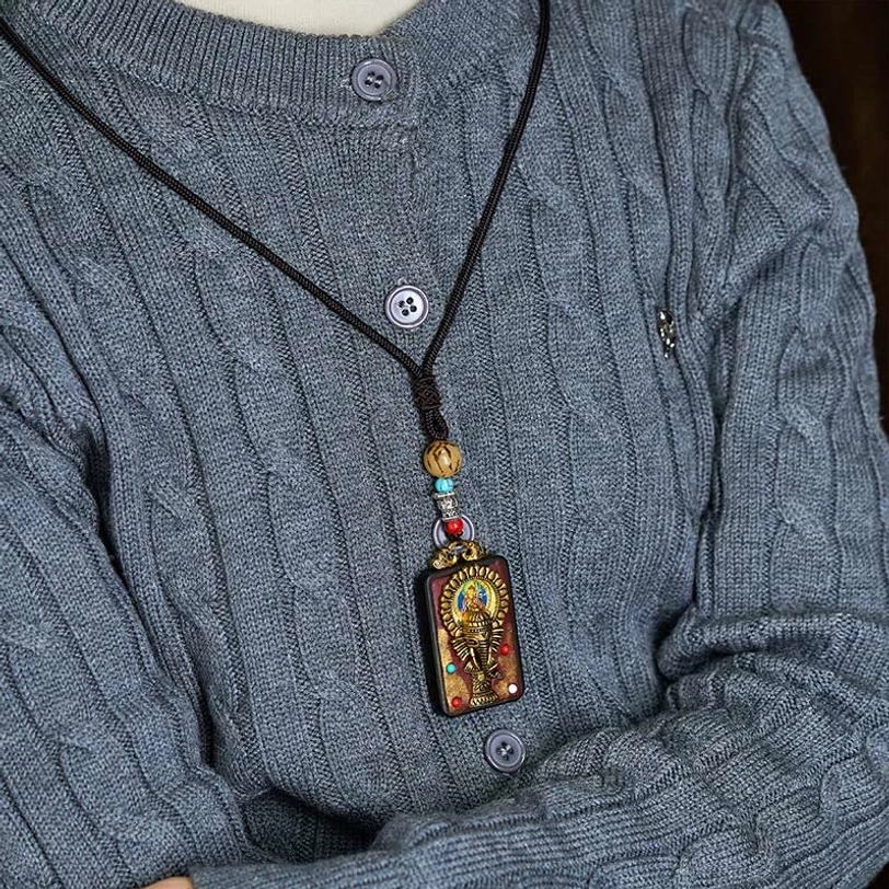 Ganesha ebony wood protection talisman necklace artisan crafted detail view