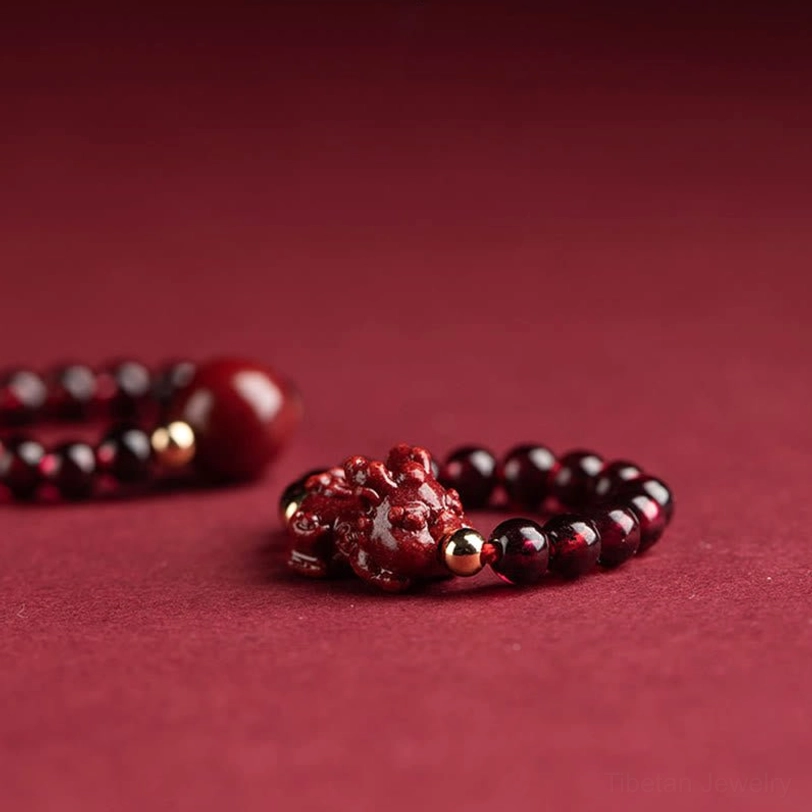 Garnet cinnabar Om Mani Padme Hum ring adjustable fit demonstration with natural stone texture and craftsmanship detail