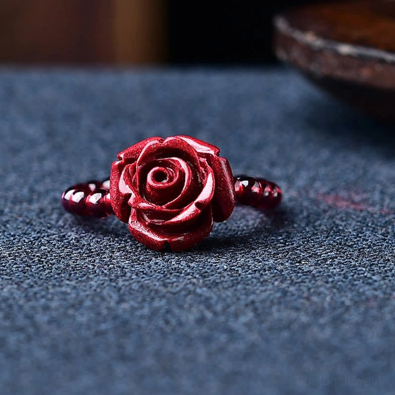 Garnet and cinnabar beaded ring collection showing multiple protective charm styles and natural stone authenticity