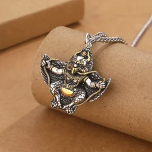 Garuda Bird necklace side view showing antique silver with gold belly accent and textured scale details on pendant
