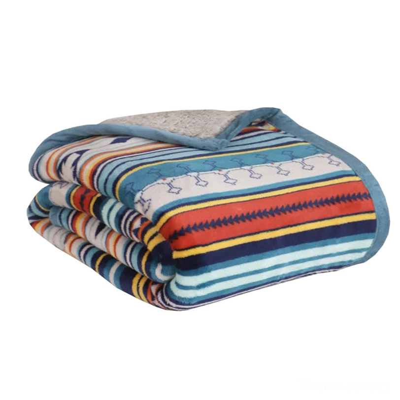 Geometric sherpa blanket detail shot highlighting the ethnic pattern weaving, texture, and color vibrancy of sacred geometry design