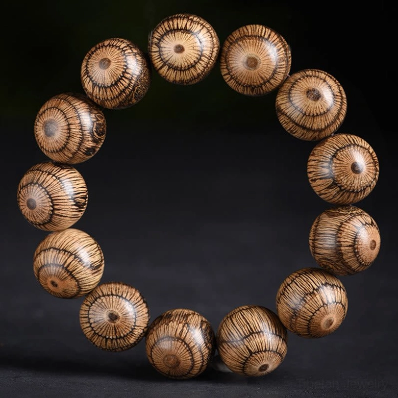 Full overhead view of Gnetum wood beaded bracelet with warm neutral brown uniform round beads