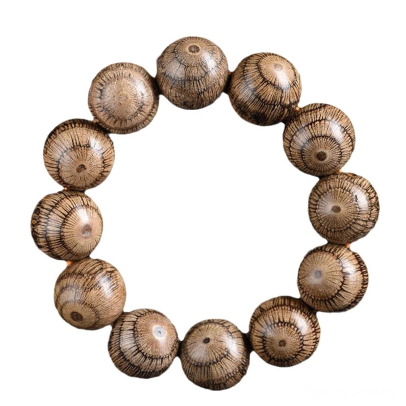 Gnetum wood beaded bracelet overhead presentation with consistent round bead design on dark plain background