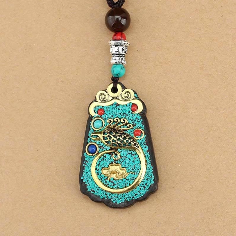 God of Wealth Tibetan thangka pendant variant with direct prosperity invocation and sacred Buddhist iconography on natural ebony wood