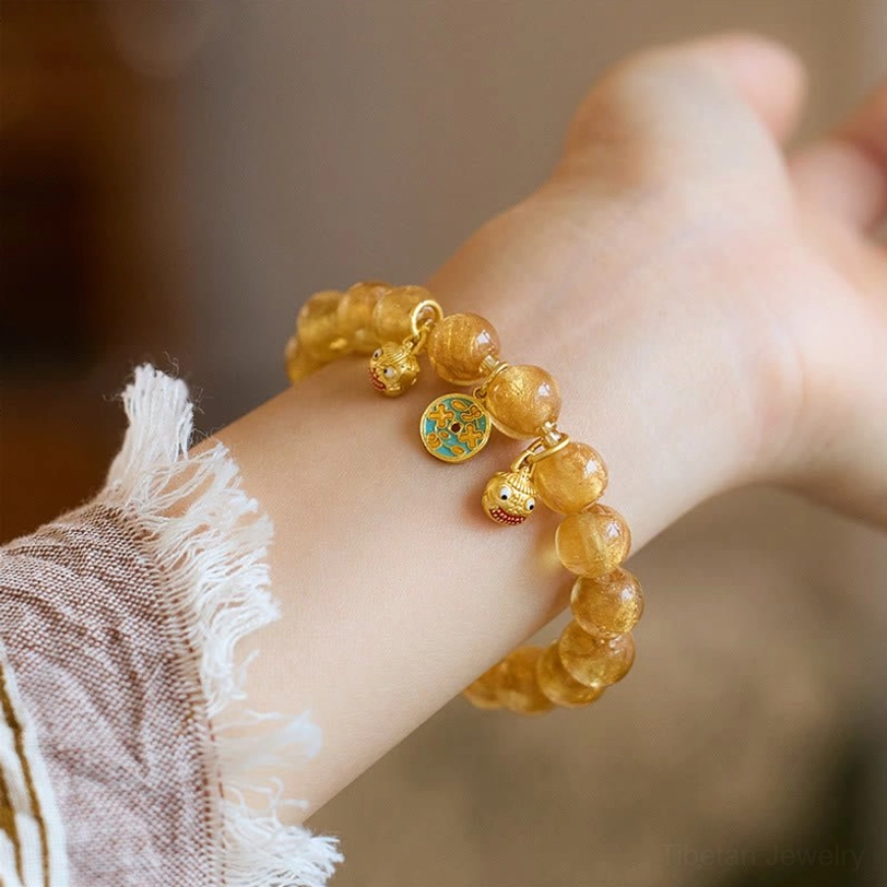 Gold liuli glass fortune bracelet with sacred Pi Xiu charm and incense ash glass beads
