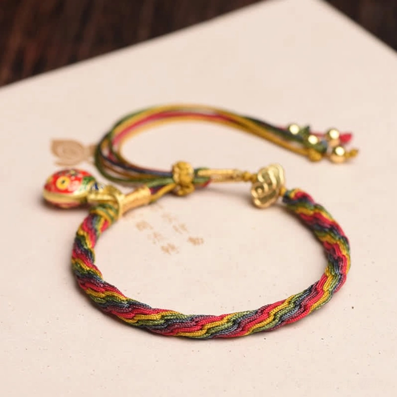 Two Gold Swallowing Beast family bracelets comparison with multicolor twisted rope and gold metal accents