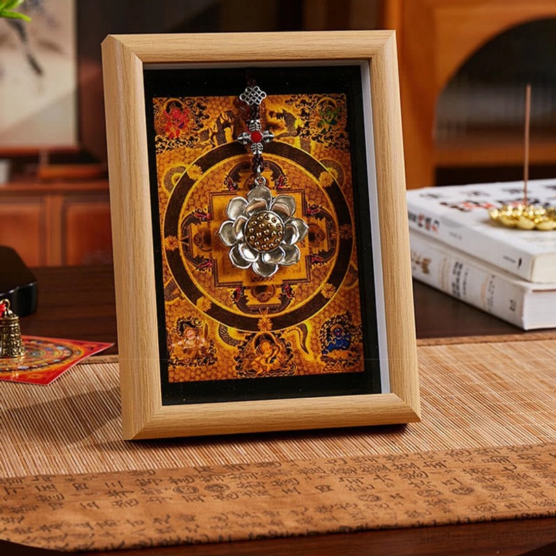 Golden lotus thangka frame with light wood finish and orange mandala design, zen meditation room decor with ornamental silver lotus accent