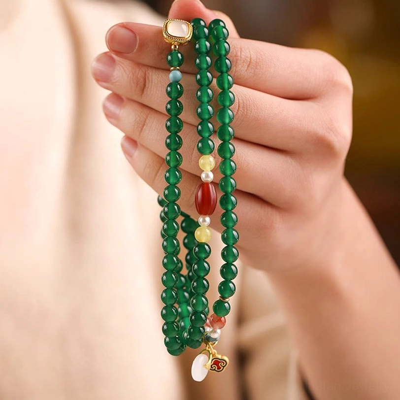 Green agate Tibetan bead bracelet with peace buckle charm and natural stone variations