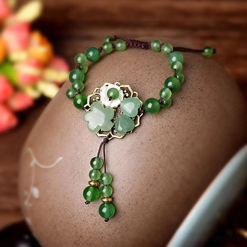 Green jade flower bracelet with aventurine stone beads representing prosperity and good fortune