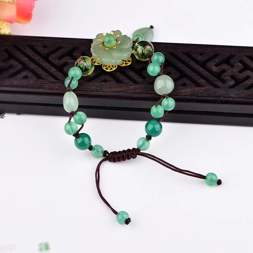 Green jade prosperity bracelet with aventurine and agate stones showing natural crystal healing properties