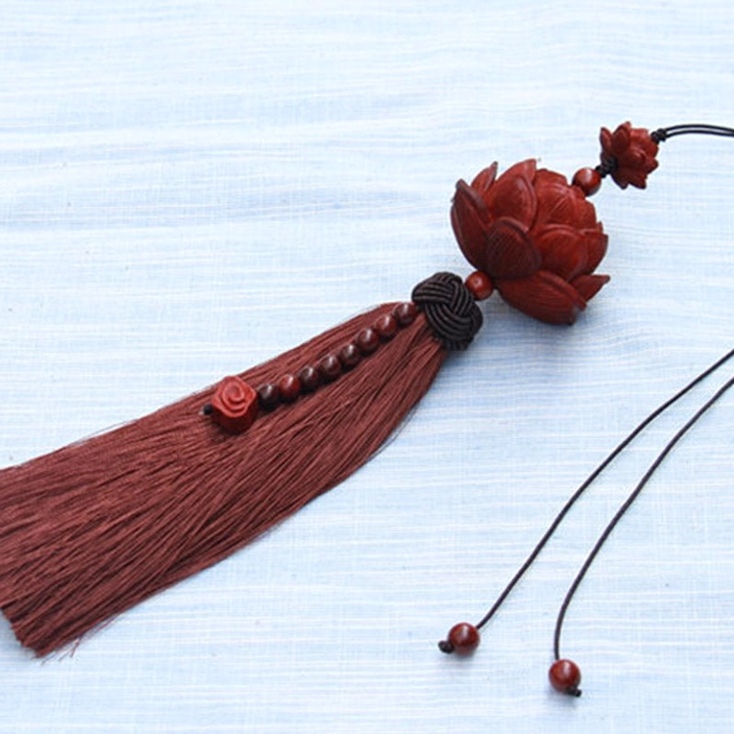 Green Tibetan sandalwood lotus tassel decoration and bracelet combo showing color variation and versatile styling