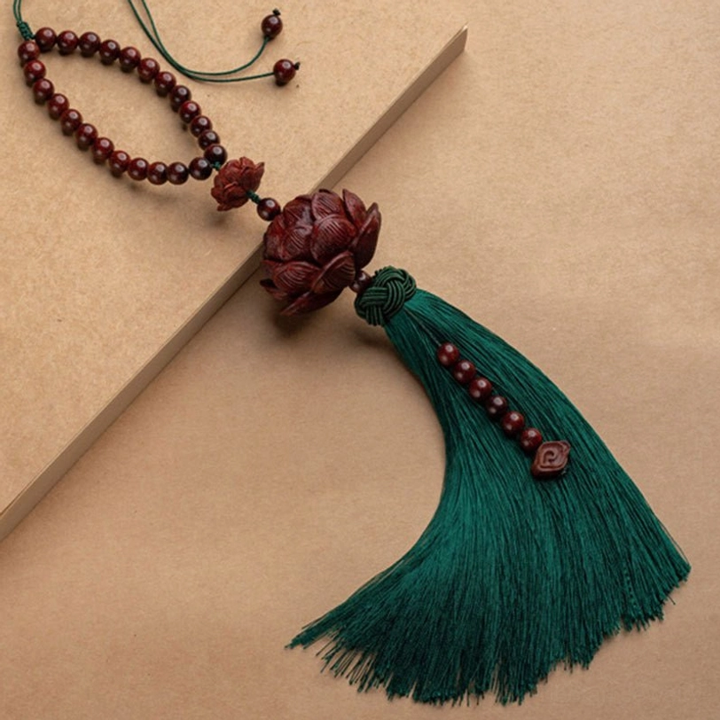 Green lotus tassel wrist bracelet 32-35cm adjustable with carved wooden lotus charm and beaded string