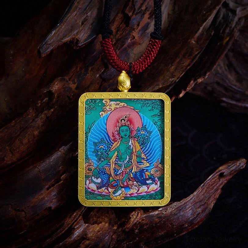 Green Tara compassion Bodhisattva thangka pendant with hand-painted green deity and gold frame - symbol of hope and healing