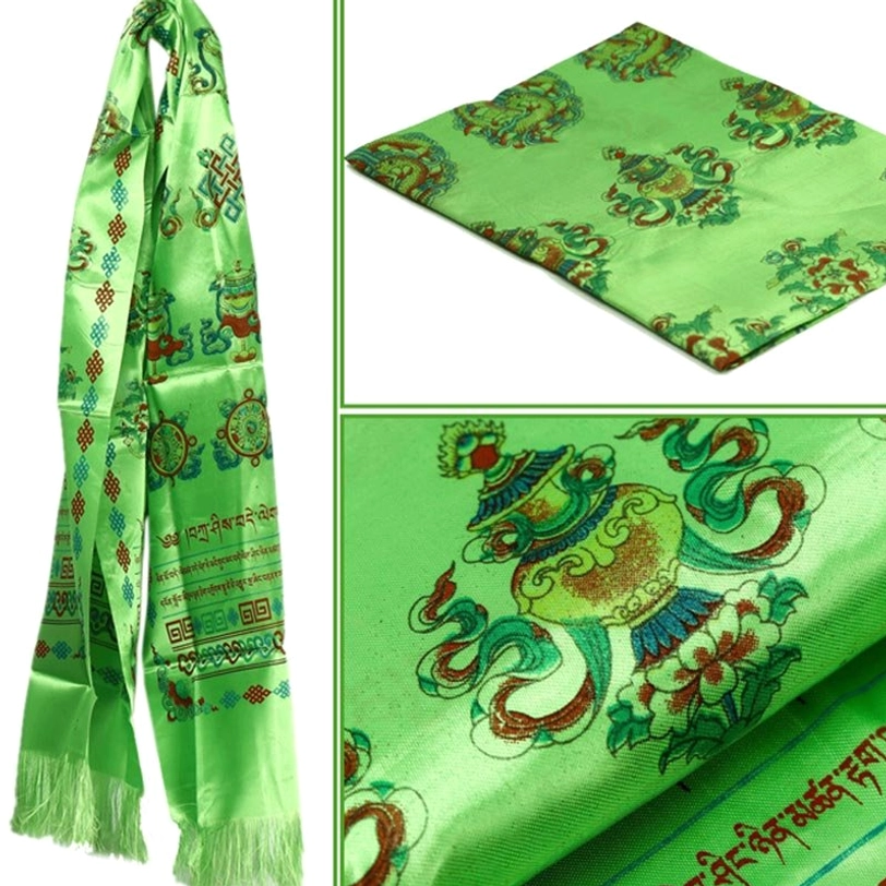 Green Tibetan khata blessing scarf displaying sacred Buddhist patterns, satin texture, and decorative tasseled ends in traditional style