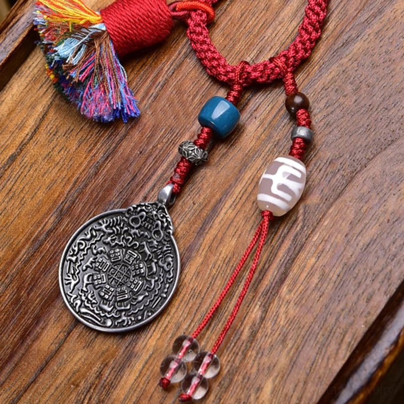 Premium hand-painted Dzi bead keychain featuring intricate geometric patterns, red braided rope, decorative tassel, and silver Bagua plaque