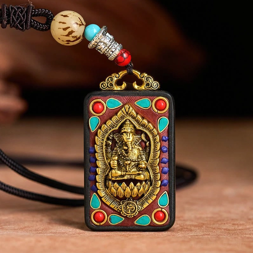 Handcarved Ganesha ebony wood spiritual necklace with turquoise sacred inlay