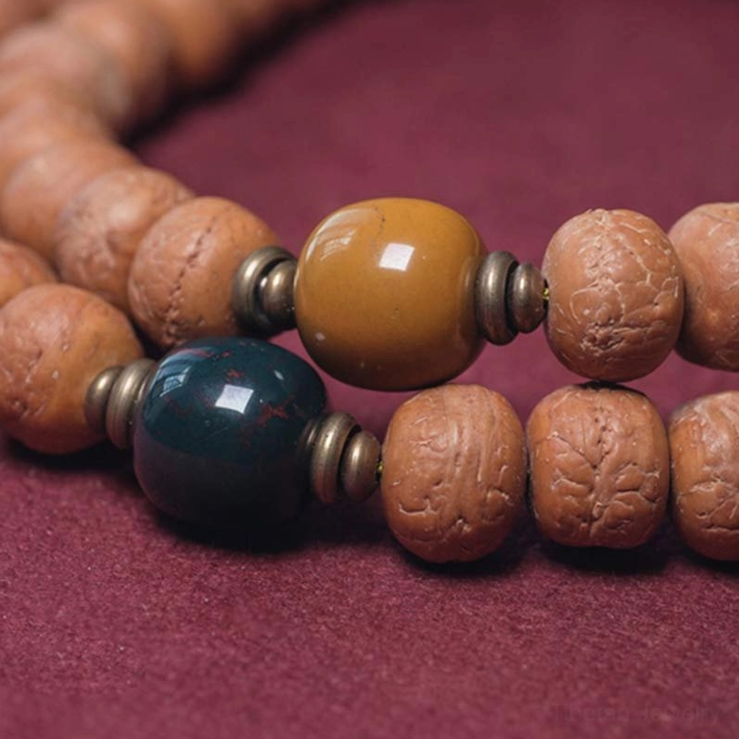 Handcrafted mala bead necklace with natural bodhi seeds and protective stone accents