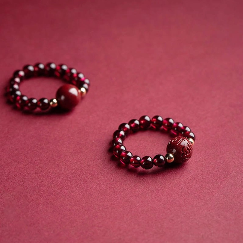 Handcrafted garnet and cinnabar beaded ring with natural stone variations and authentic Tibetan craftsmanship details