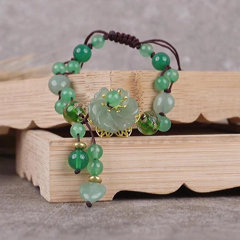 Handcrafted green jade flower bracelet featuring adjustable design and natural gemstone beads for wellness