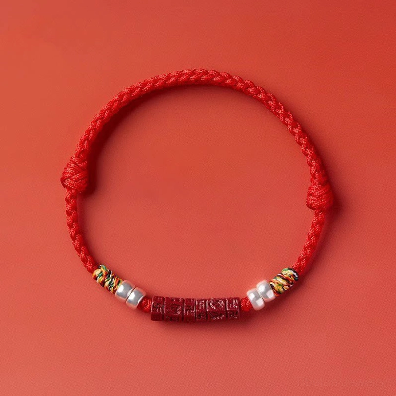 Handcrafted red blessing bracelet with natural cinnabar beads and authentic sterling silver accents