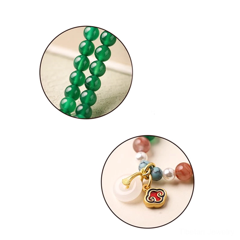 Authentic handcrafted Tibetan mala bracelet featuring green agate and traditional peace buckle symbol